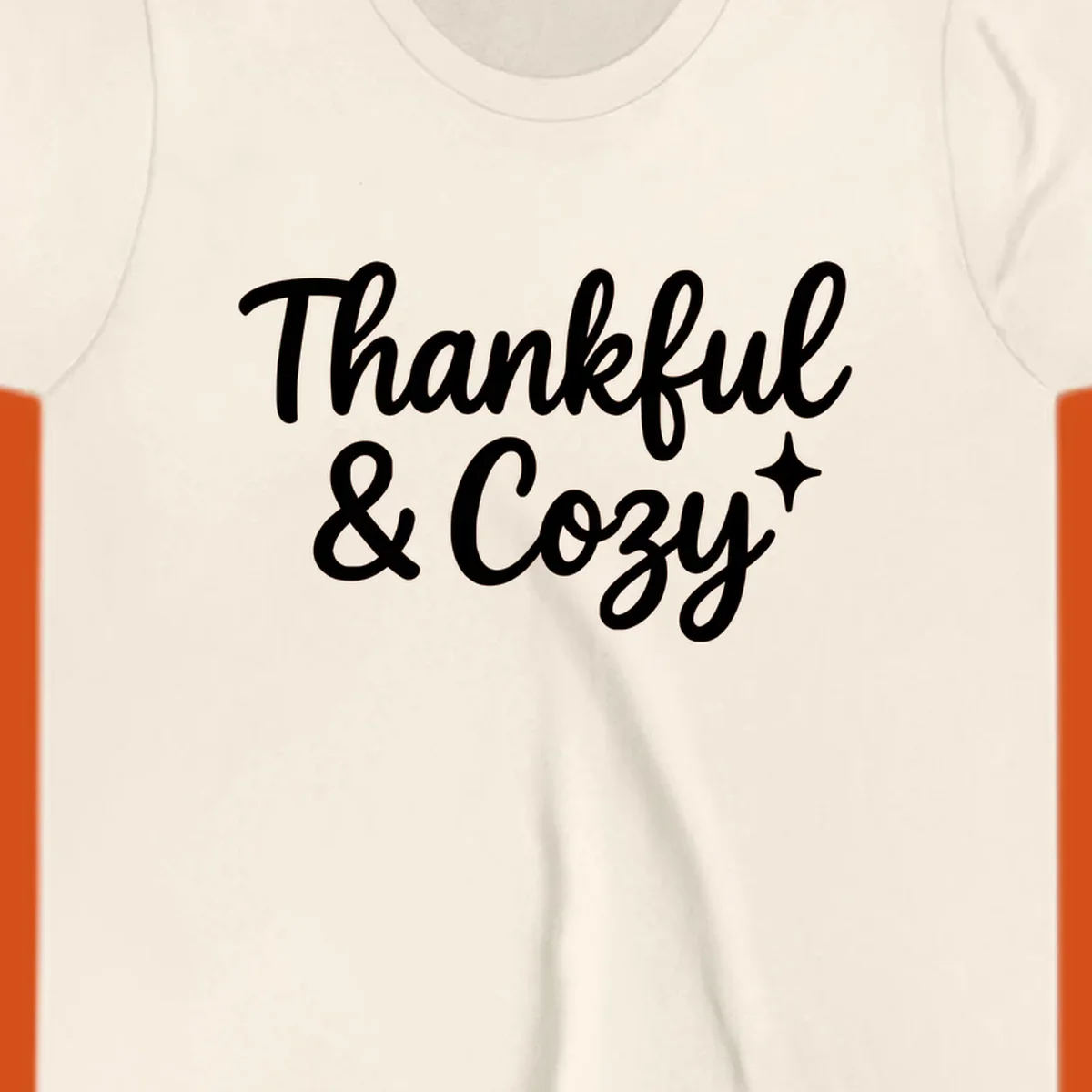 Thankful and cozy script text with starburst design.