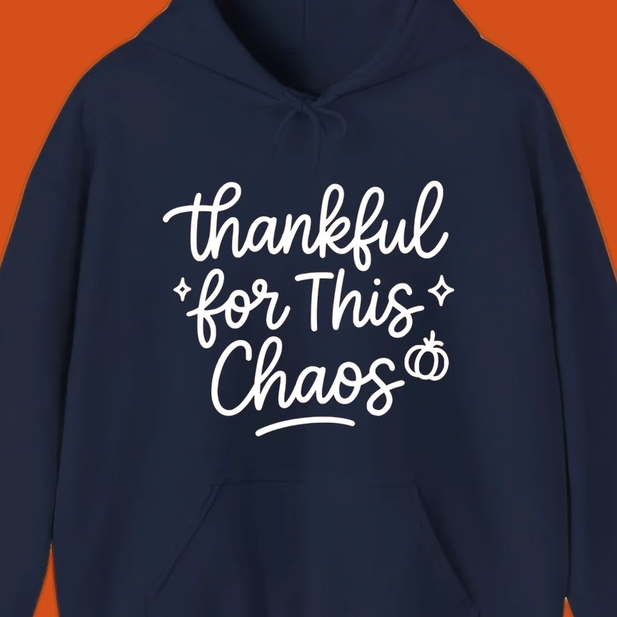 White script text 'thankful for This Chaos' with sparkles and a pumpkin on a black background.