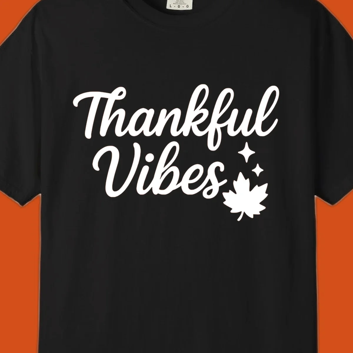 Thankful Vibes text with fall maple leaf and sparkles graphic.