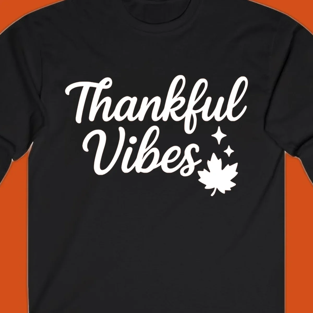 Thankful Vibes text with fall maple leaf and sparkles graphic.