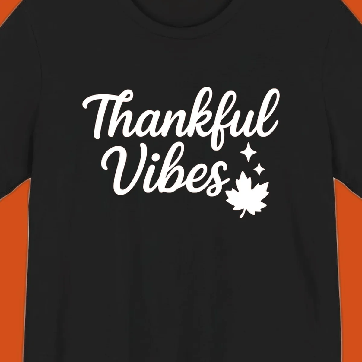 Thankful Vibes text with fall maple leaf and sparkles graphic.