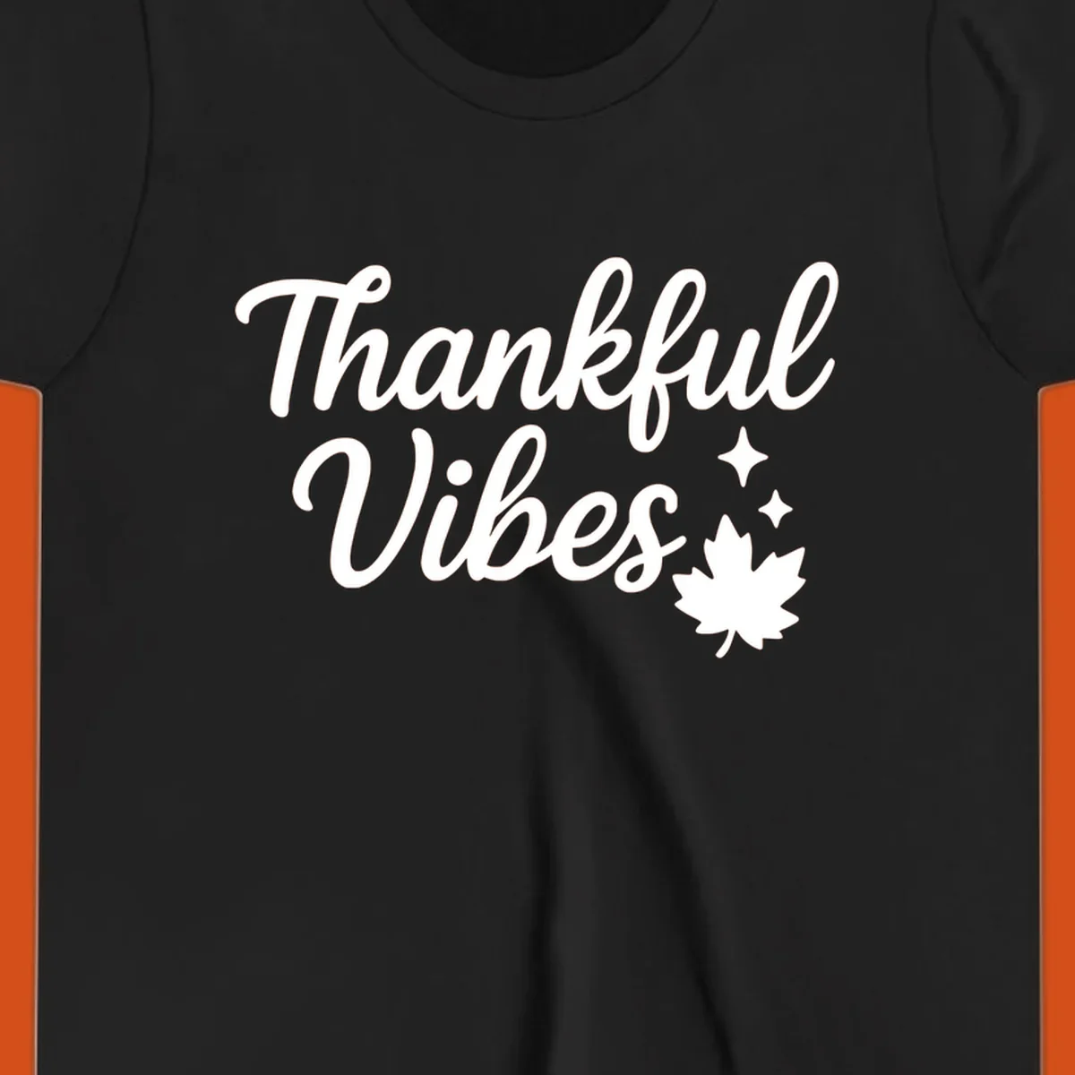 Thankful Vibes text with fall maple leaf and sparkles graphic.