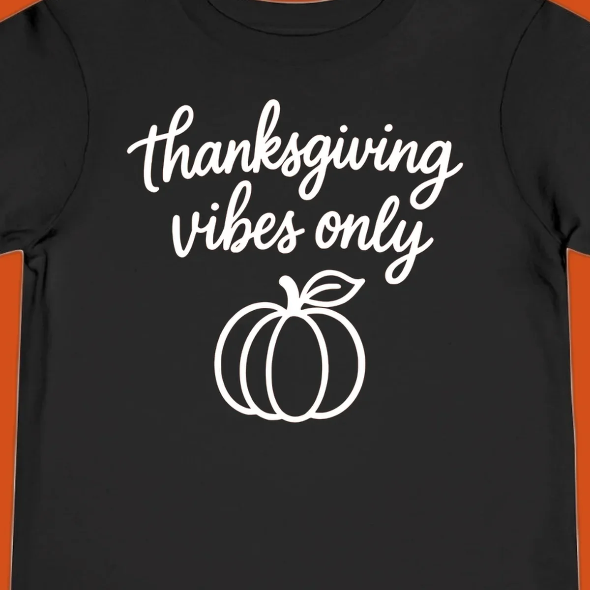 Thanksgiving vibes only text with a pumpkin graphic. Thanksgiving-vibes-only.