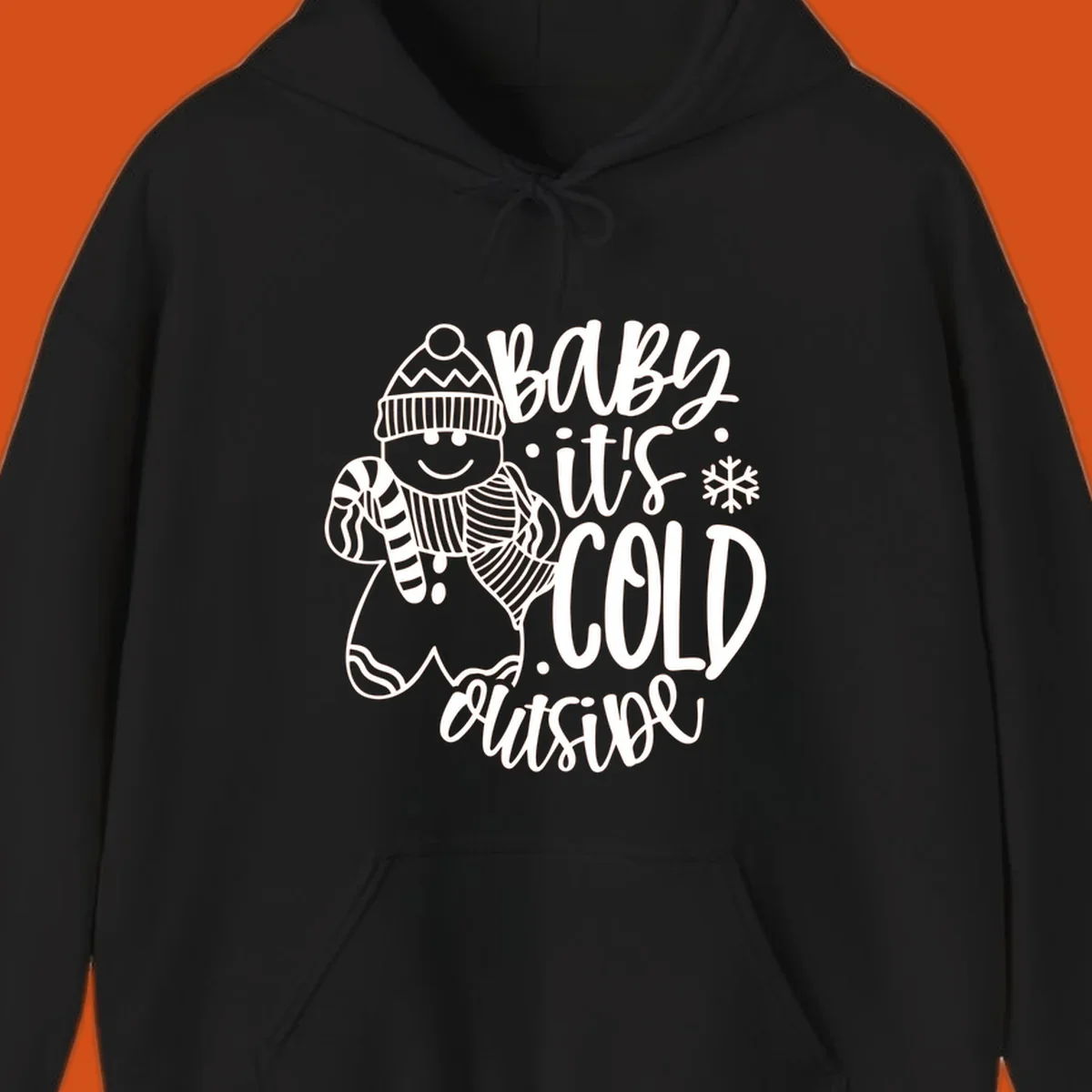 Baby it's cold outside gingerbread man with snowflake graphic.