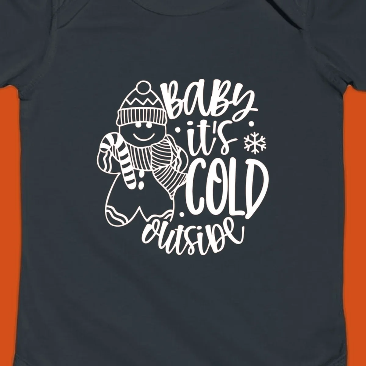 Baby it's cold outside gingerbread man with snowflake graphic.