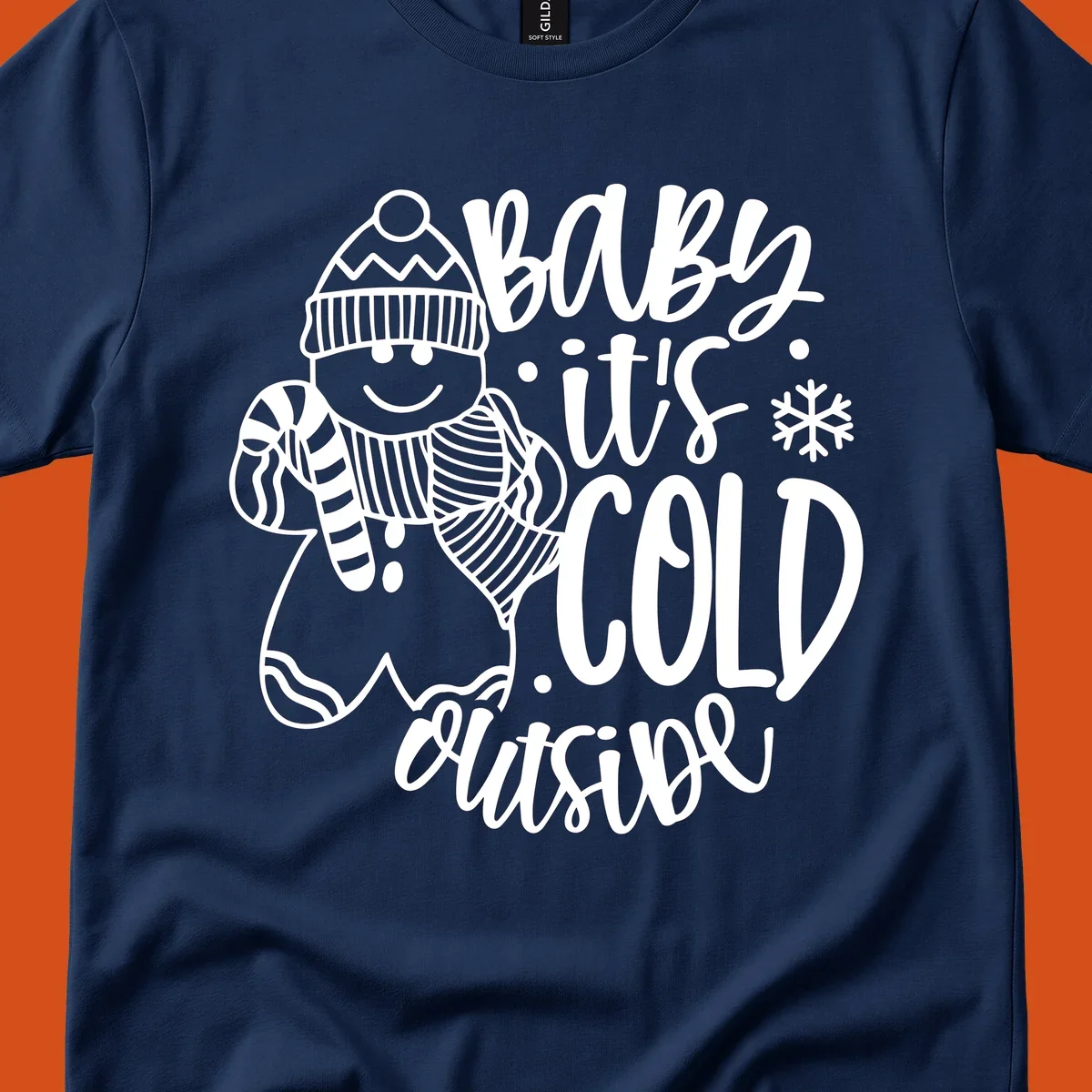 Baby it's cold outside gingerbread man with snowflake graphic.