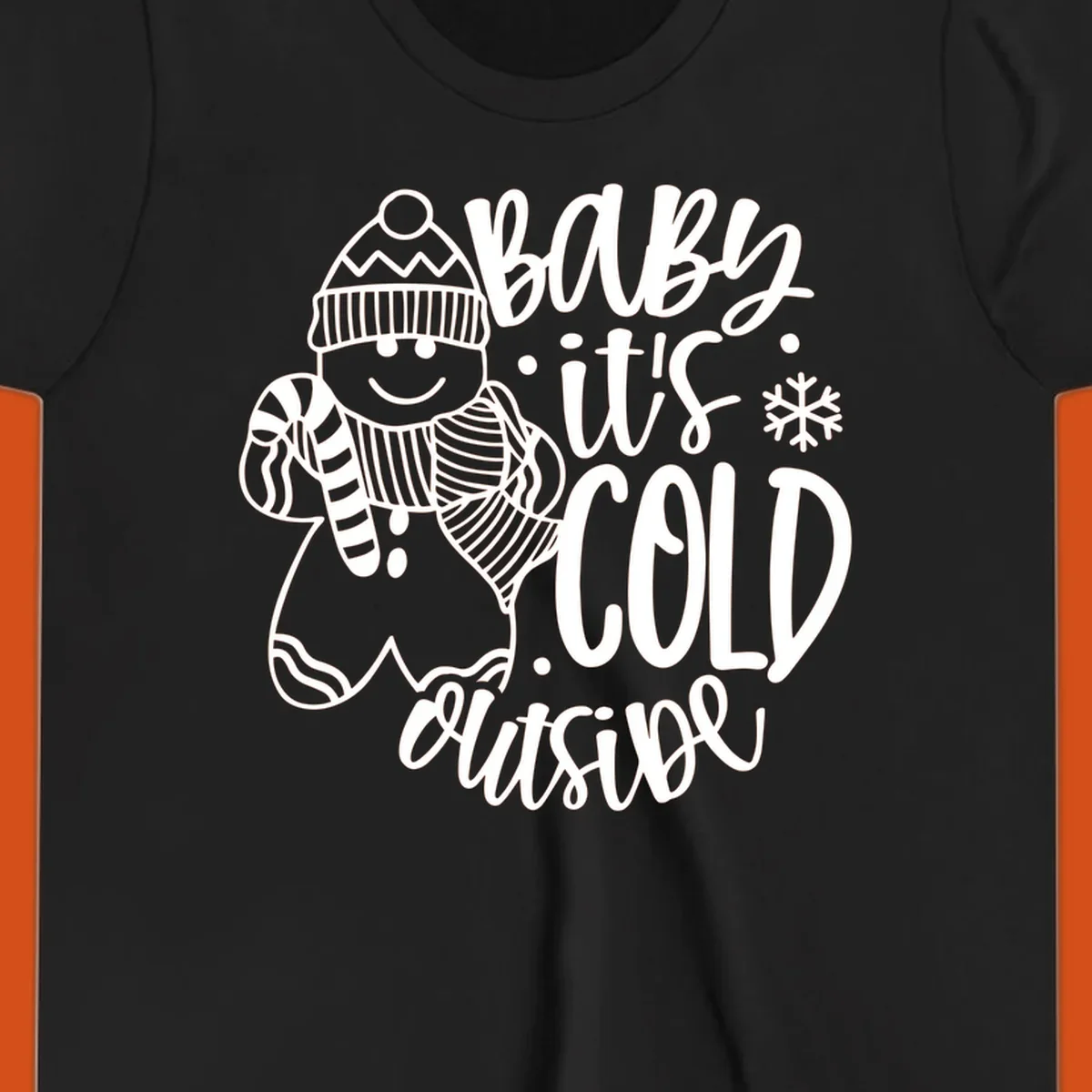 Baby it's cold outside gingerbread man with snowflake graphic.