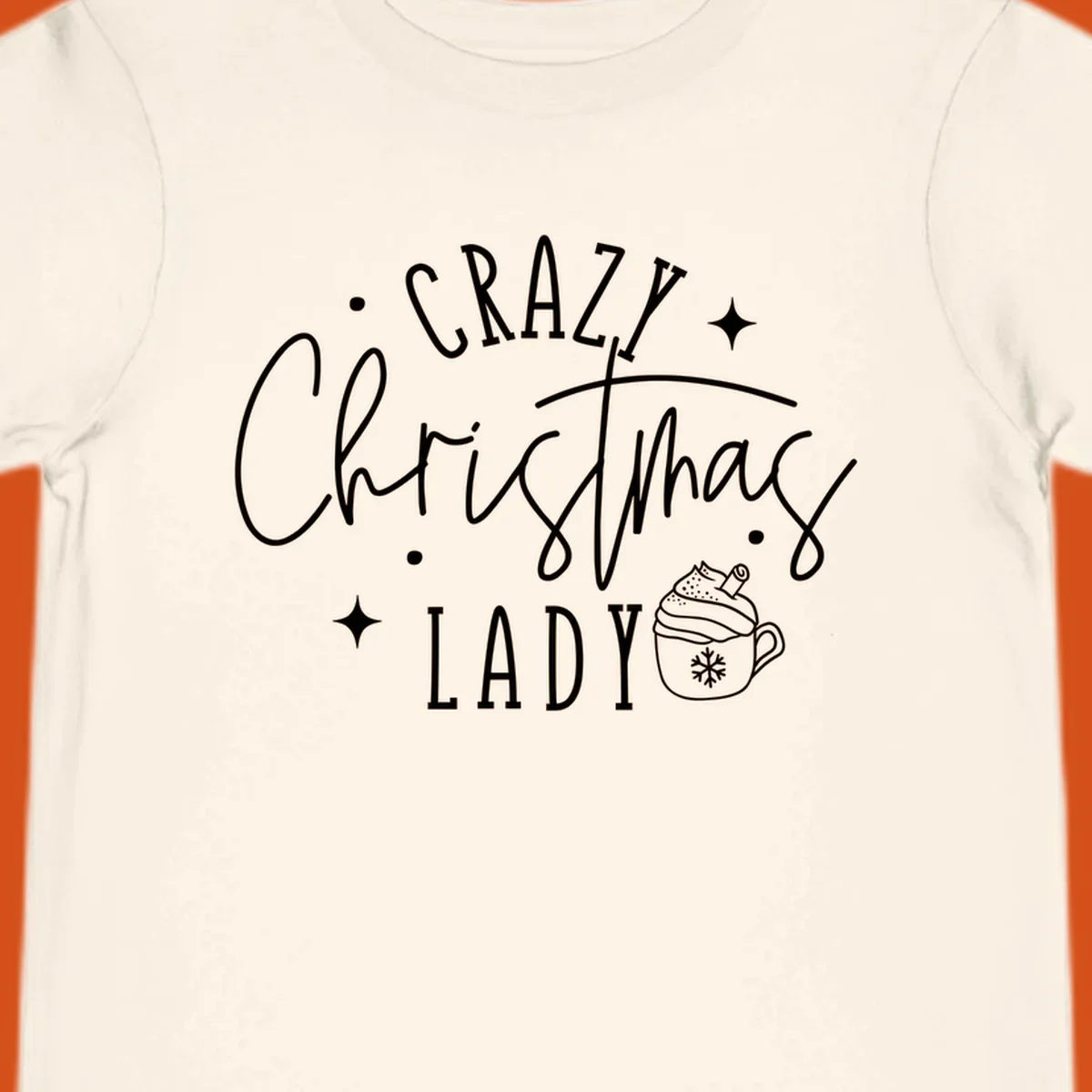 Crazy Christmas Lady text with a festive mug and stars design.