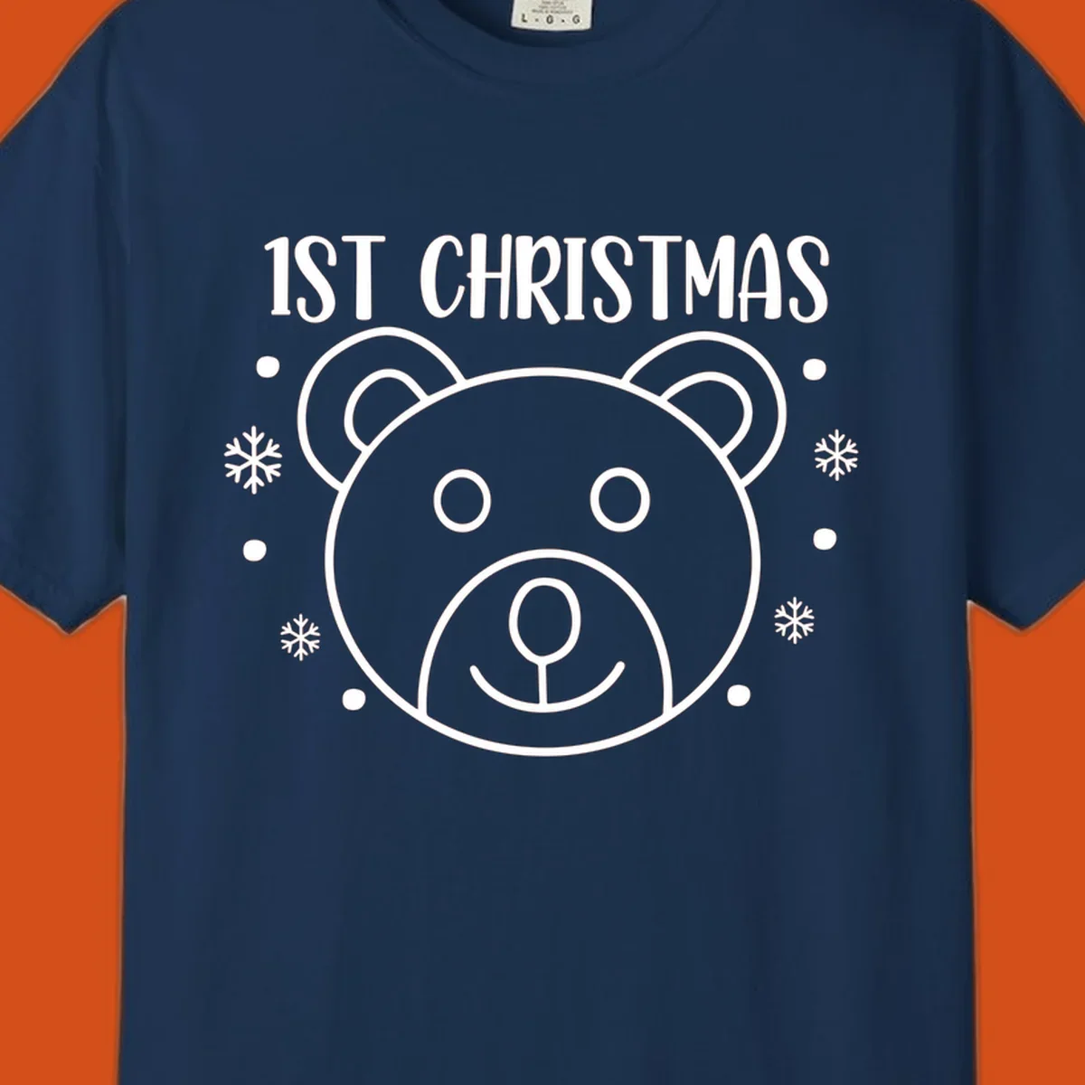 Baby's first christmas bear graphic with text and snowflakes.
