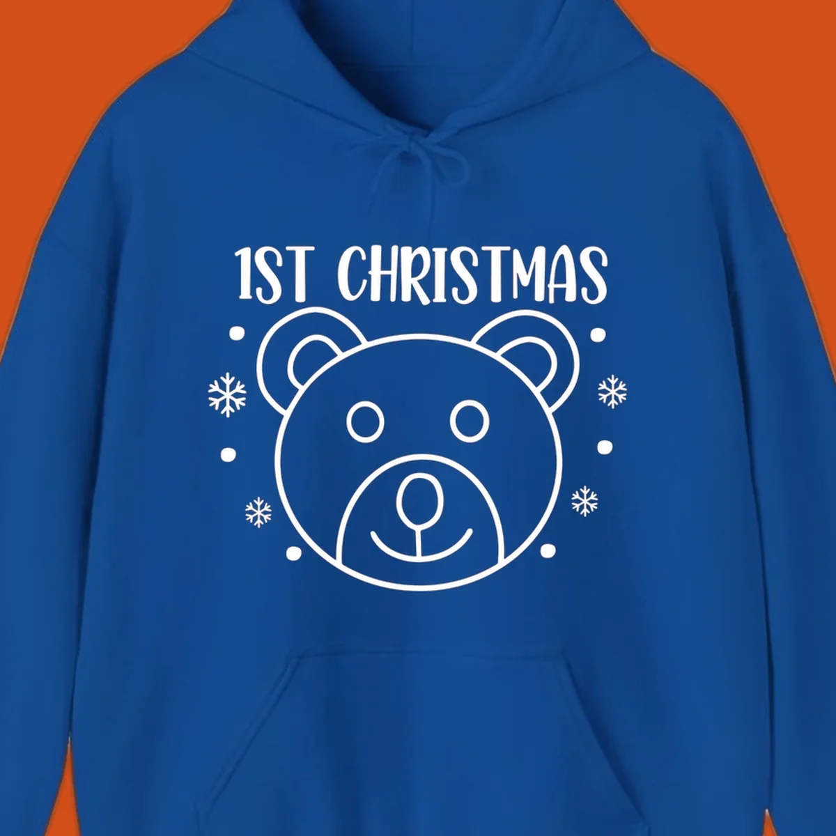 Baby's first christmas bear graphic with text and snowflakes.