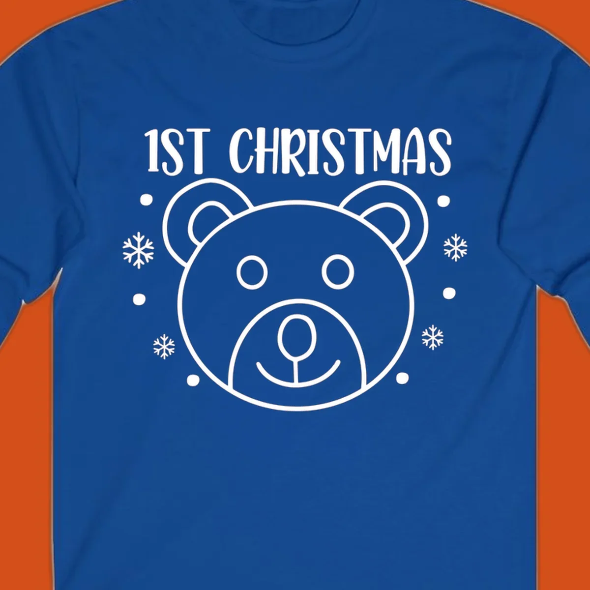 Baby's first christmas bear graphic with text and snowflakes.