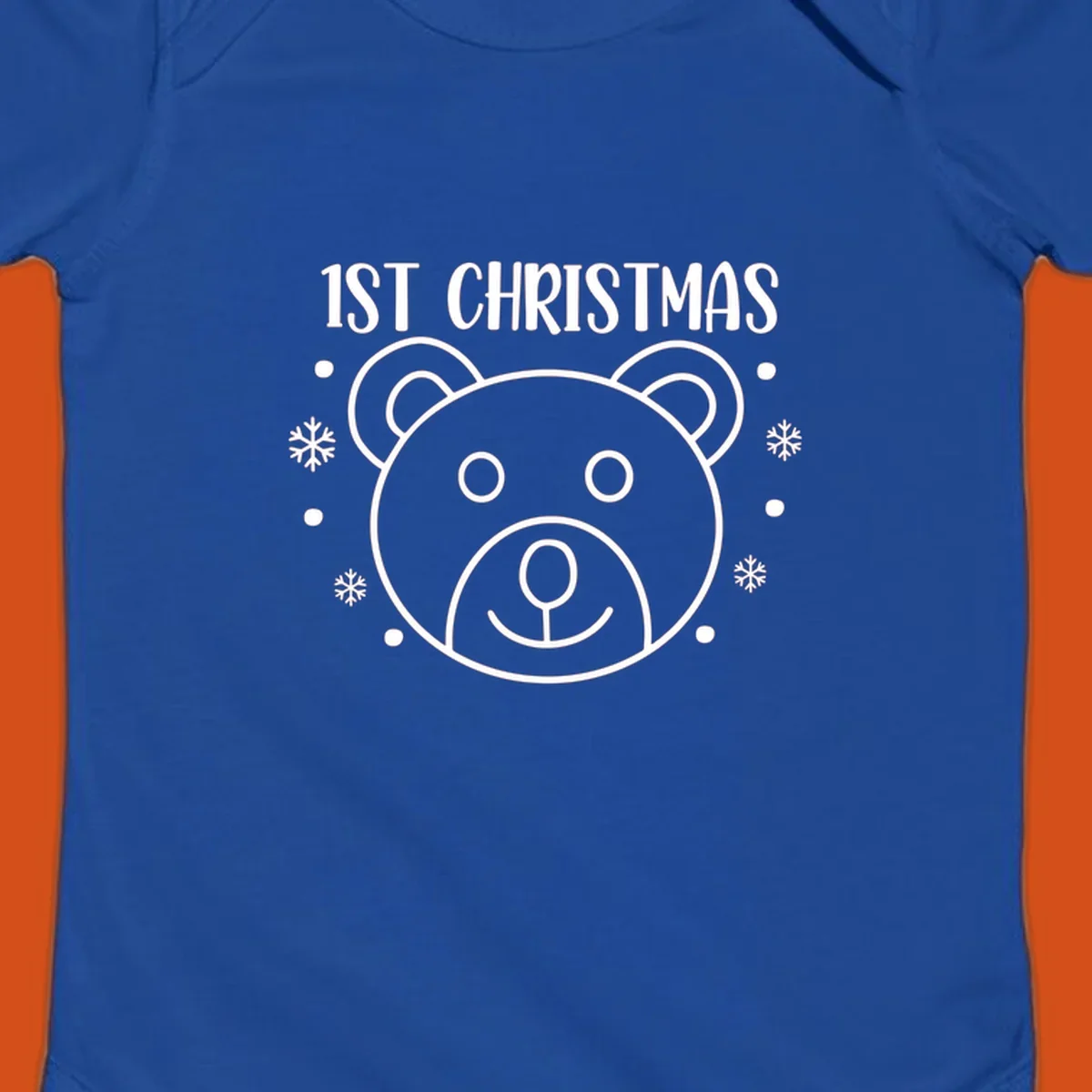 Baby's first christmas bear graphic with text and snowflakes.
