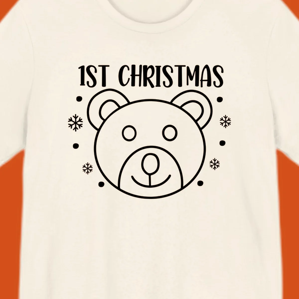 Baby's first christmas bear graphic with text and snowflakes.