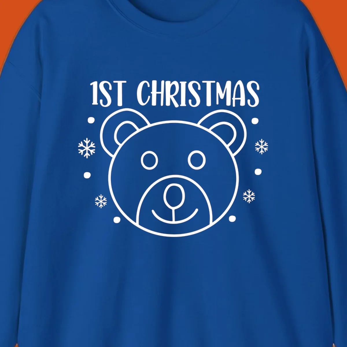 Baby's first christmas bear graphic with text and snowflakes.