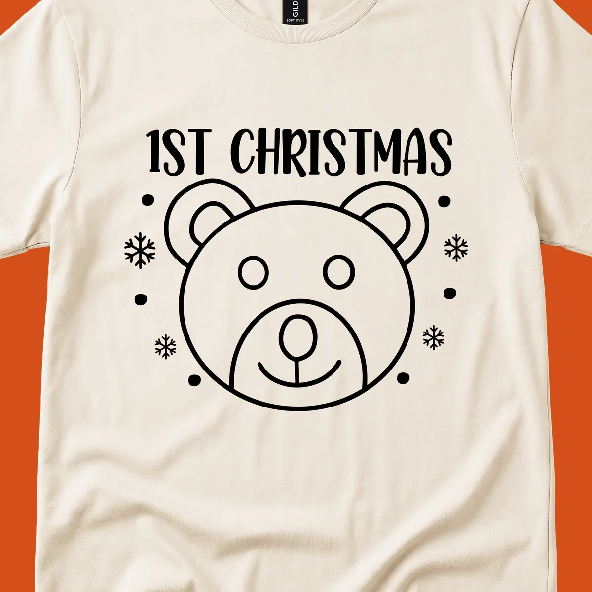 Baby's first christmas bear graphic with text and snowflakes.