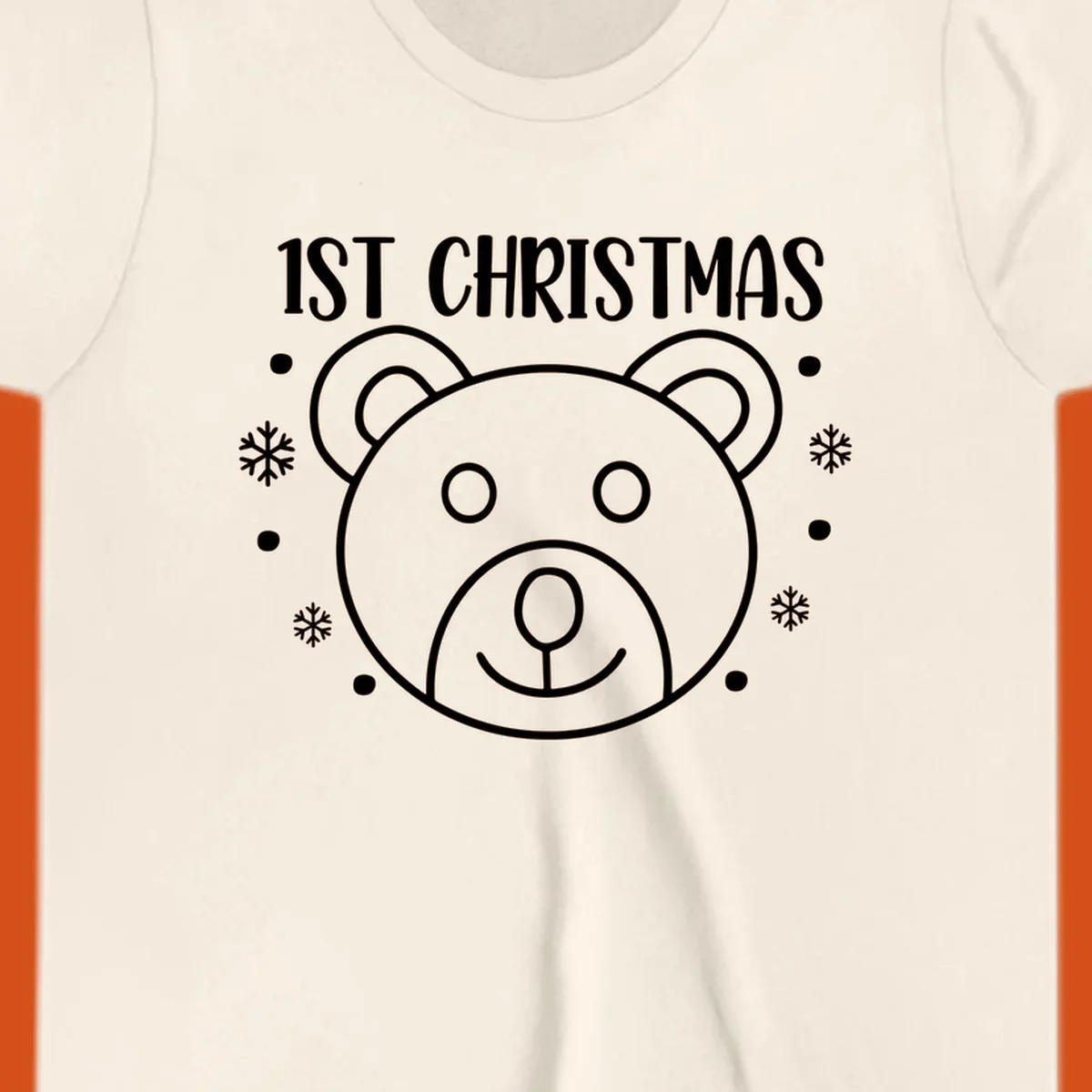 Baby's first christmas bear graphic with text and snowflakes.