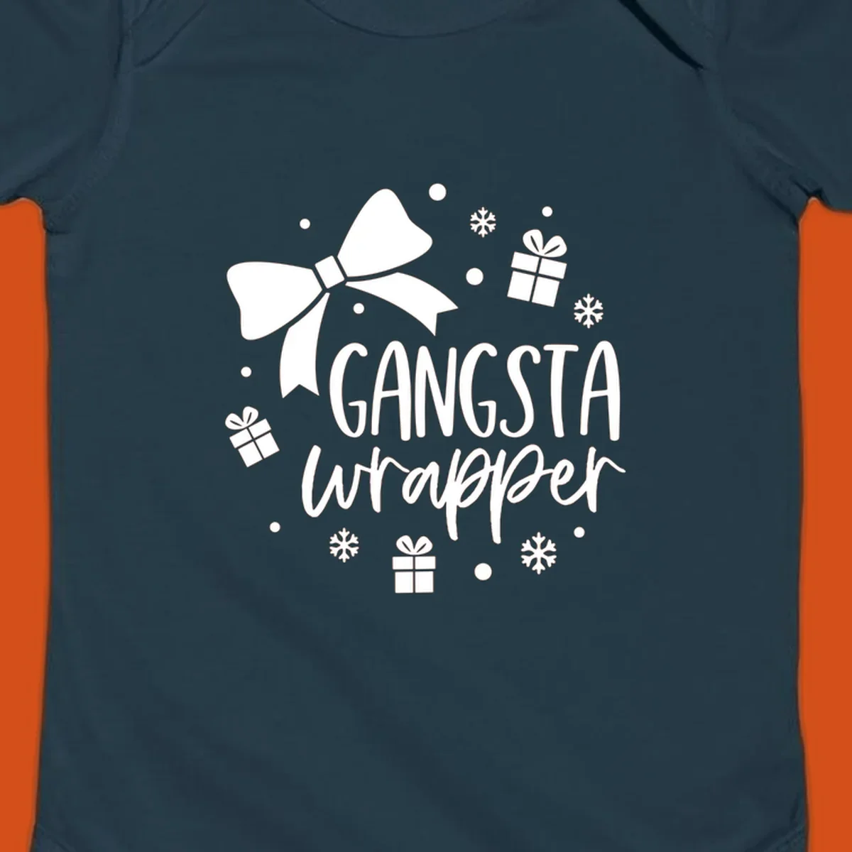 Gangsta wrapper holiday design with text, bow, gifts, and snowflakes.