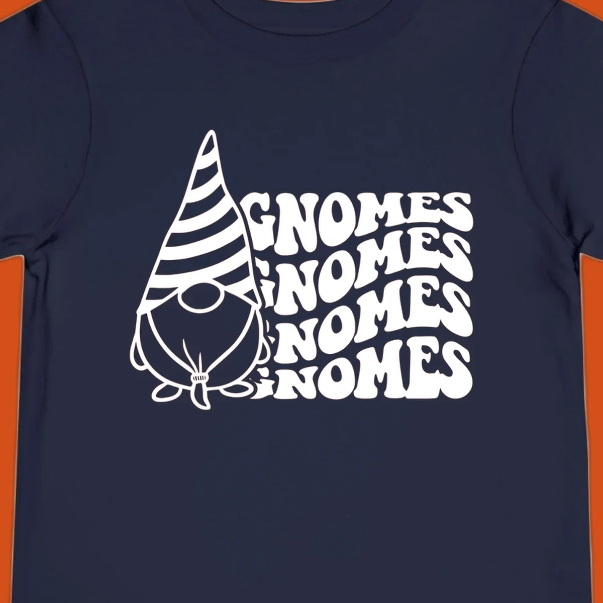 Gnome illustration with repeating wavy text that says GNOMES. Retro style graphic tee.