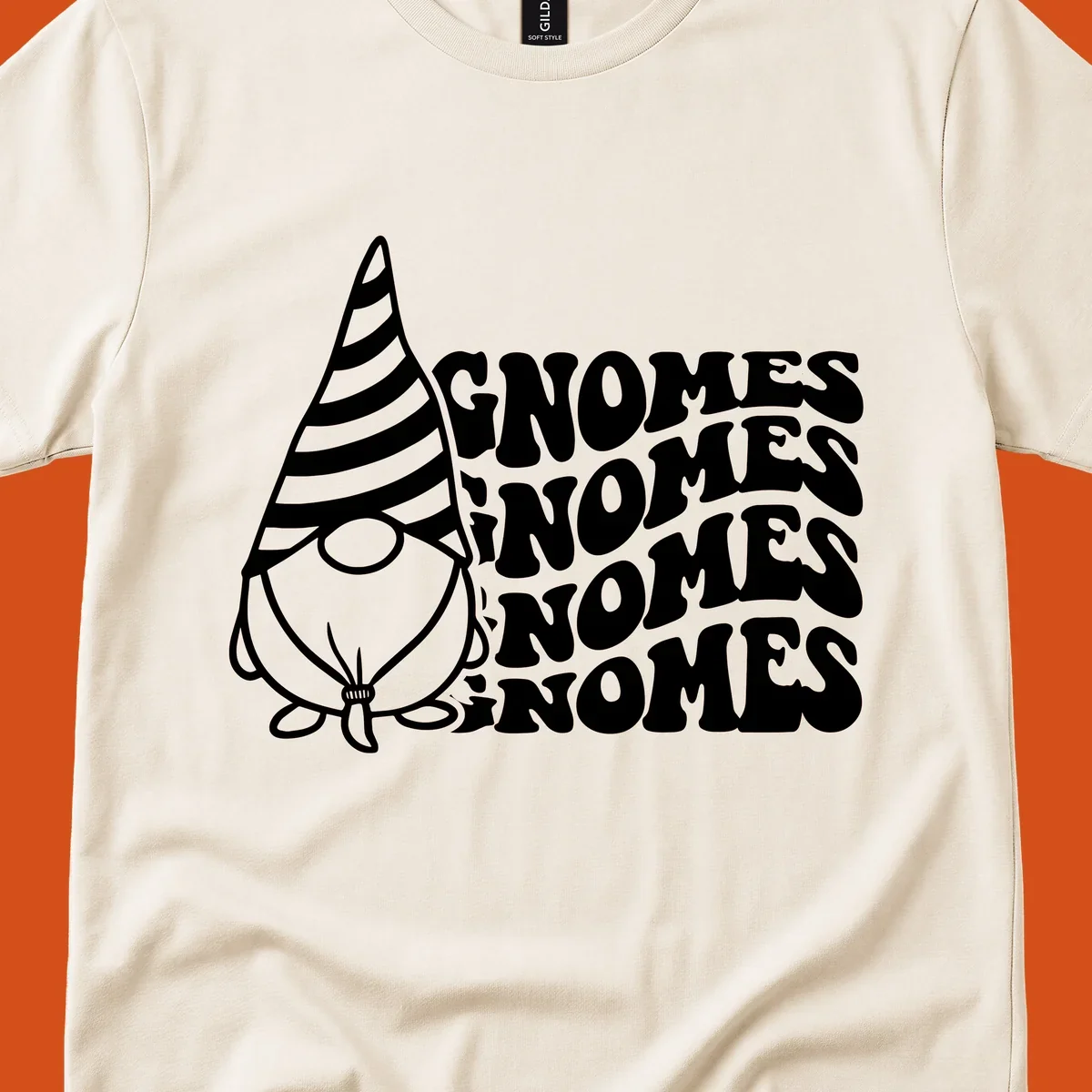 Gnome illustration with repeating wavy text that says GNOMES. Retro style graphic tee.