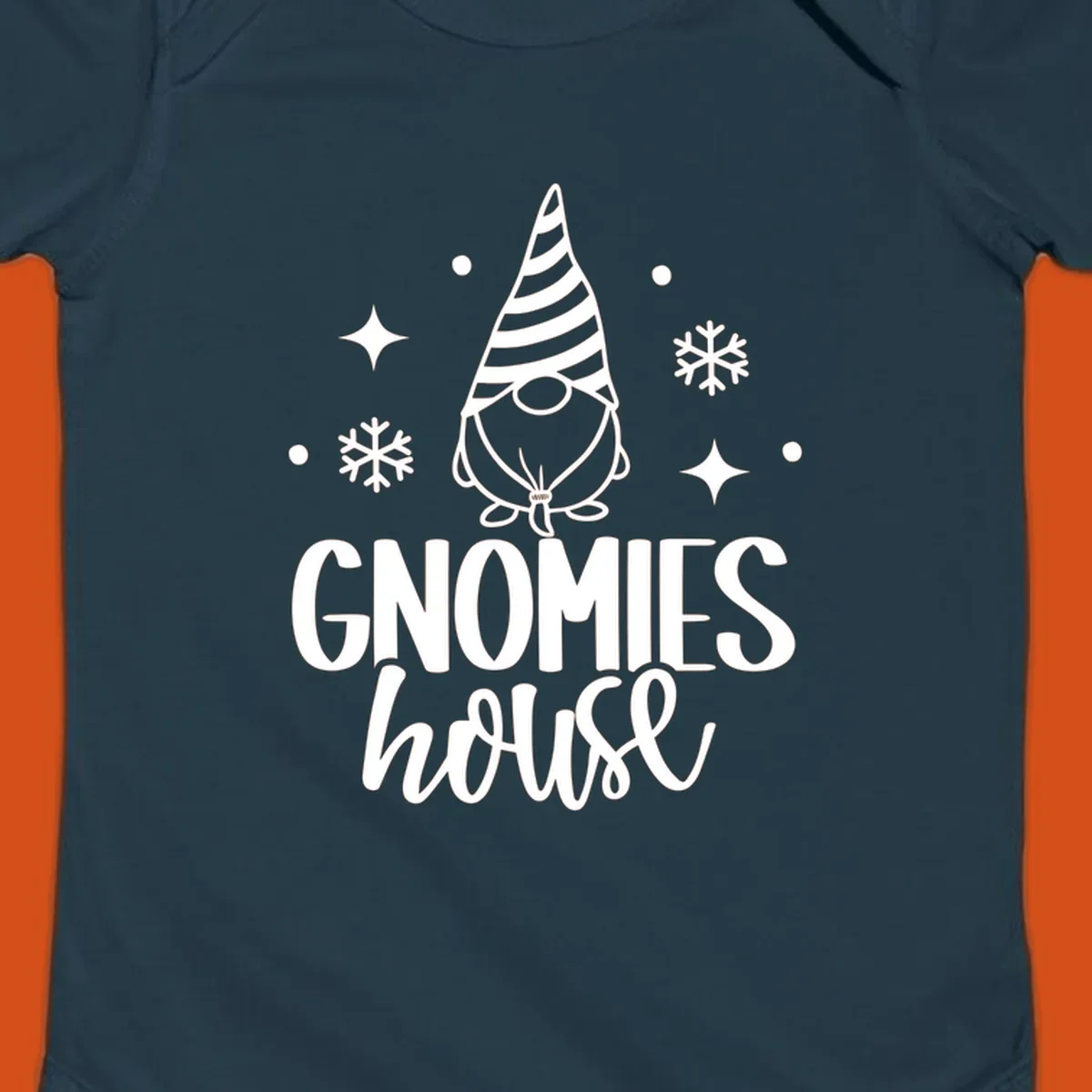 Illustration of a gnome with text 'GNOMIES house', surrounded by winter elements.