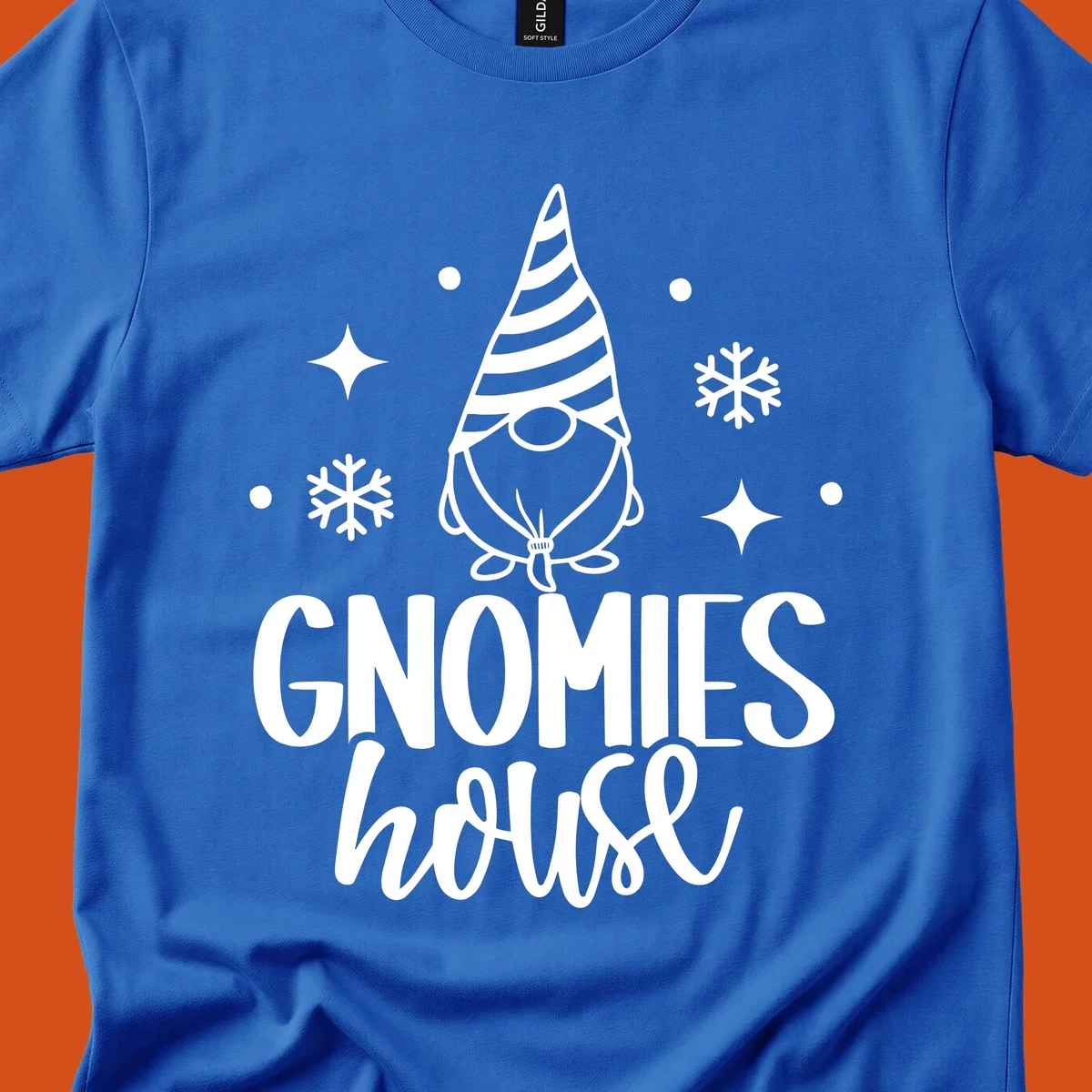 Illustration of a gnome with text 'GNOMIES house', surrounded by winter elements.