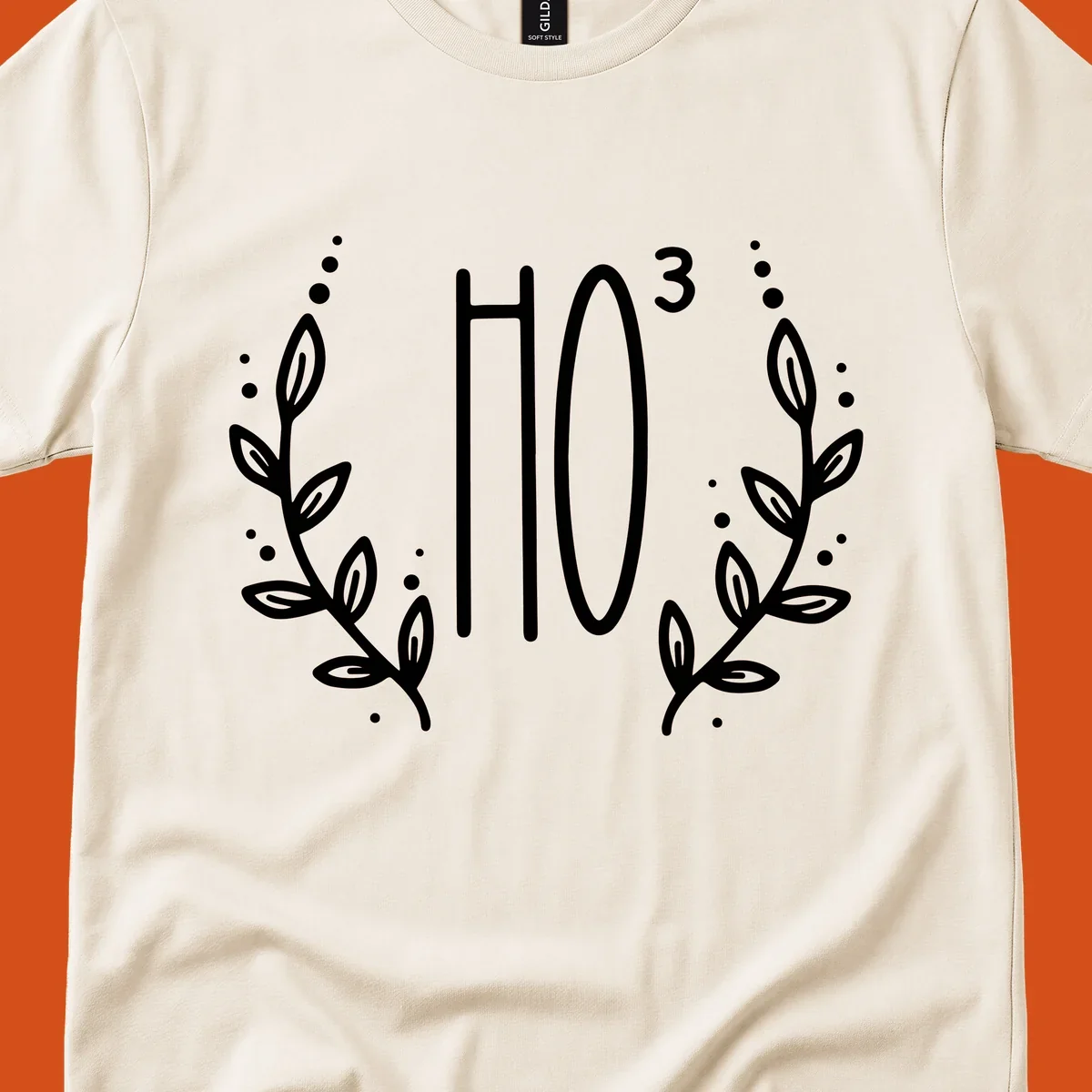 The Holiday Tee logo with stylized text HO³ framed by decorative branches.