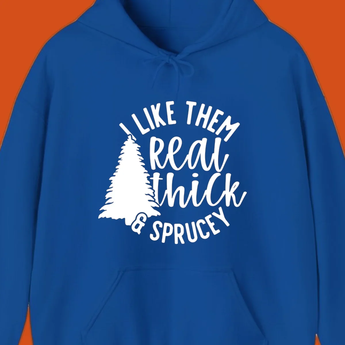 Illustration of a Christmas tree with text 'I like them real thick & sprucey', for thick-sprucey-christmas designs.