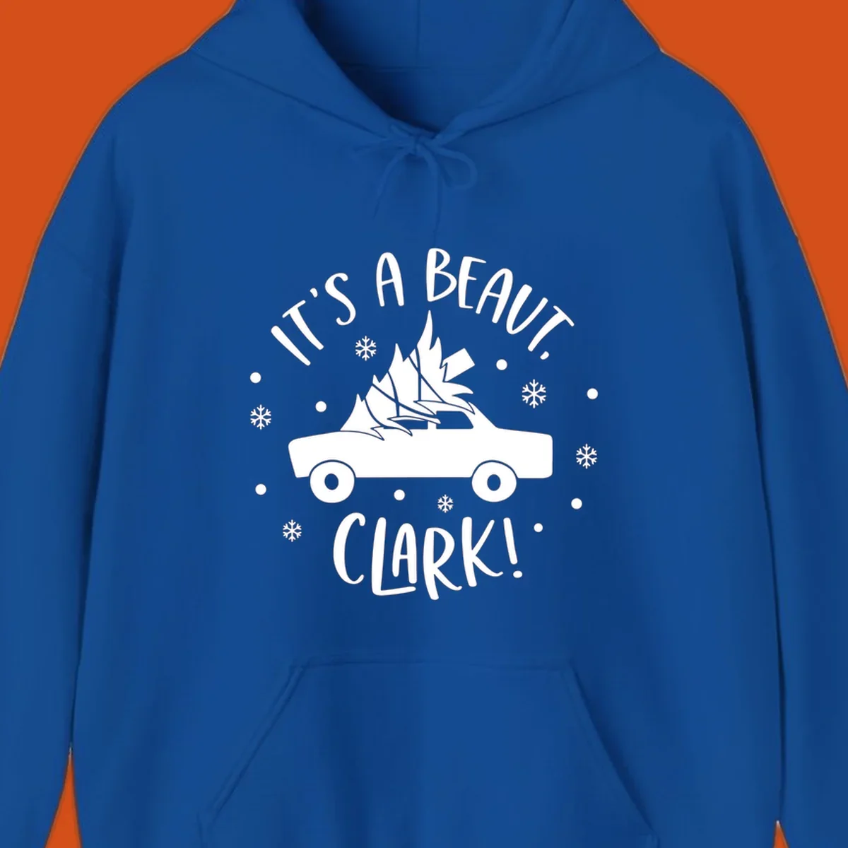 White silhouette of a car with a Christmas tree on top, and text 'IT'S A BEAUT, CLARK!'