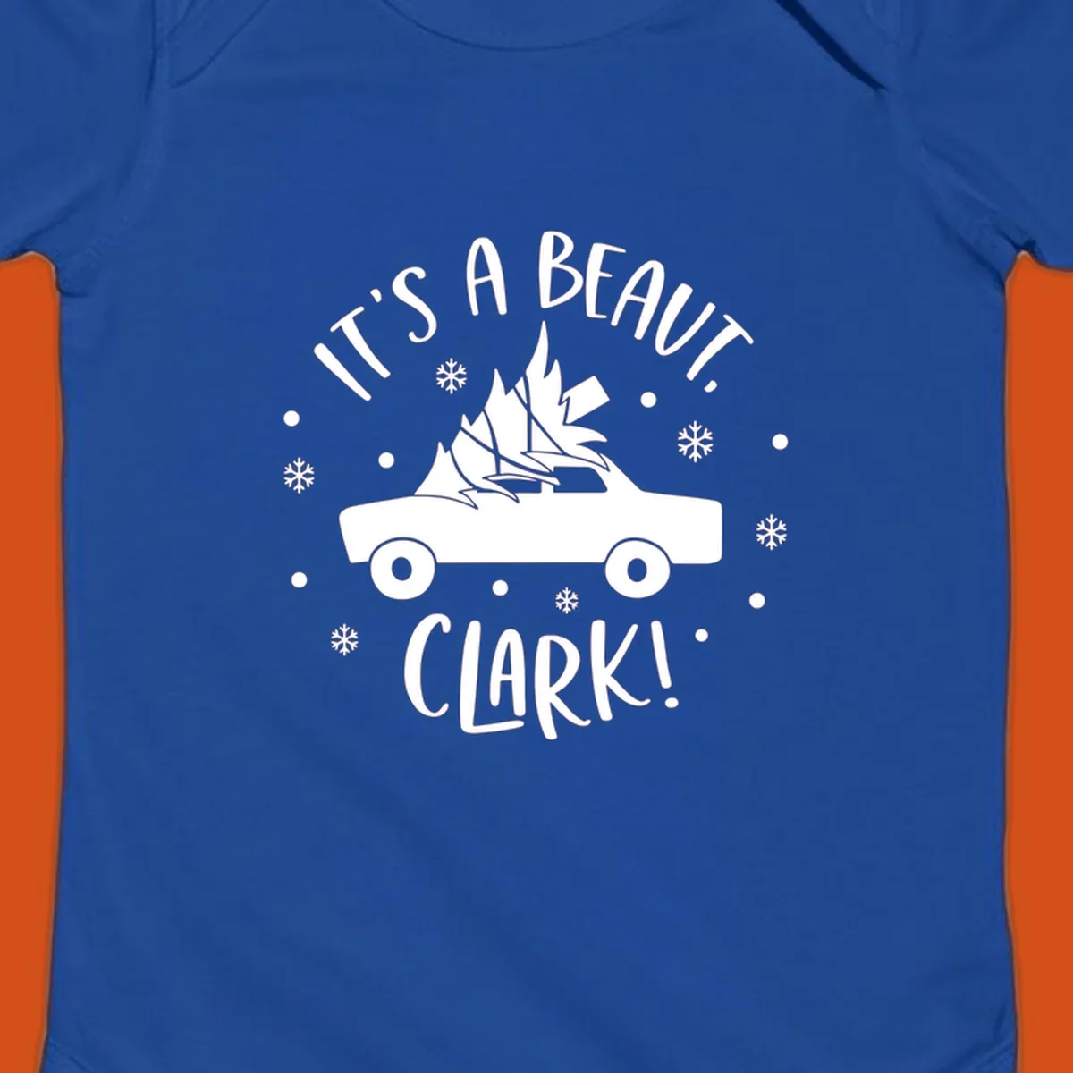 White silhouette of a car with a Christmas tree on top, and text 'IT'S A BEAUT, CLARK!'
