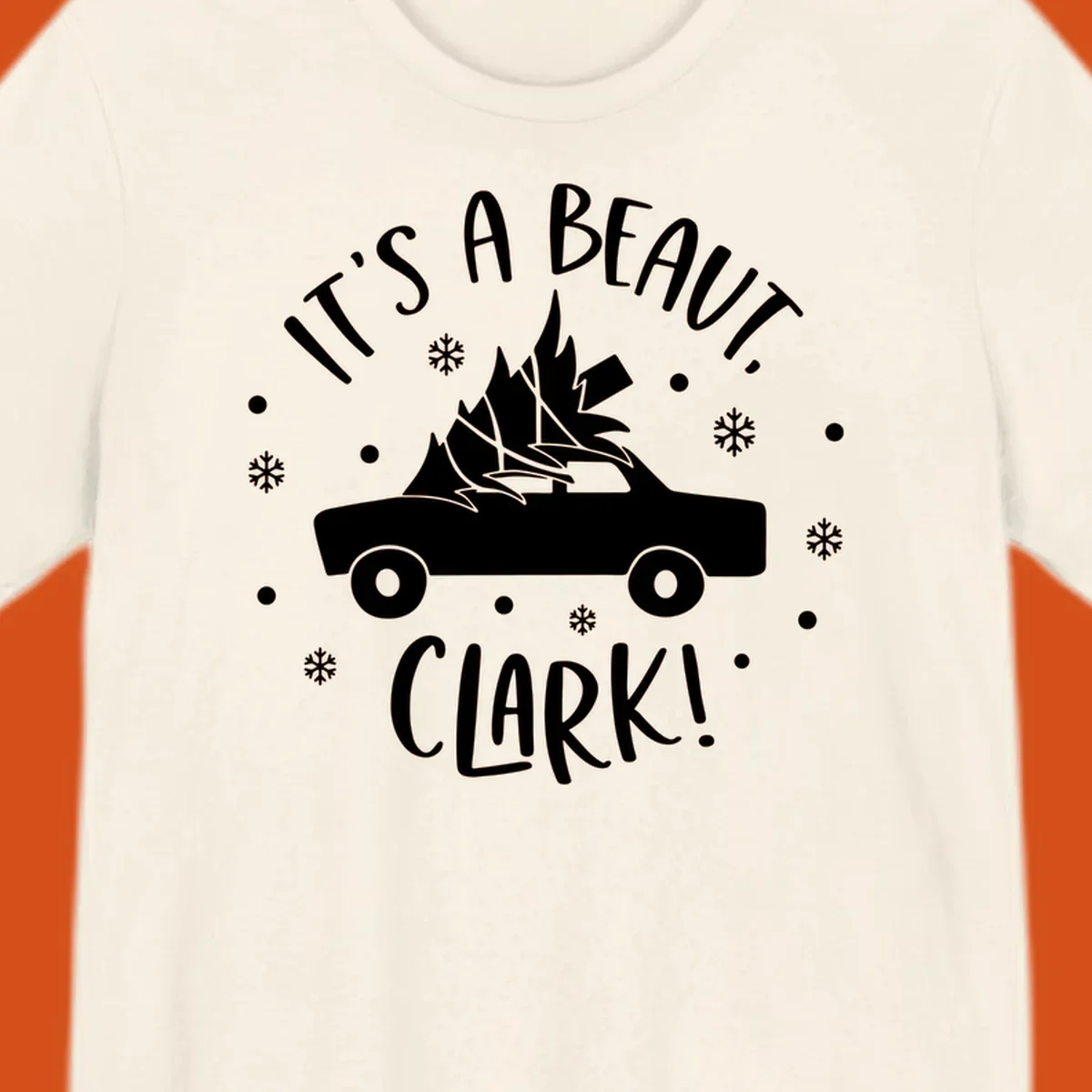 White silhouette of a car with a Christmas tree on top, and text 'IT'S A BEAUT, CLARK!'