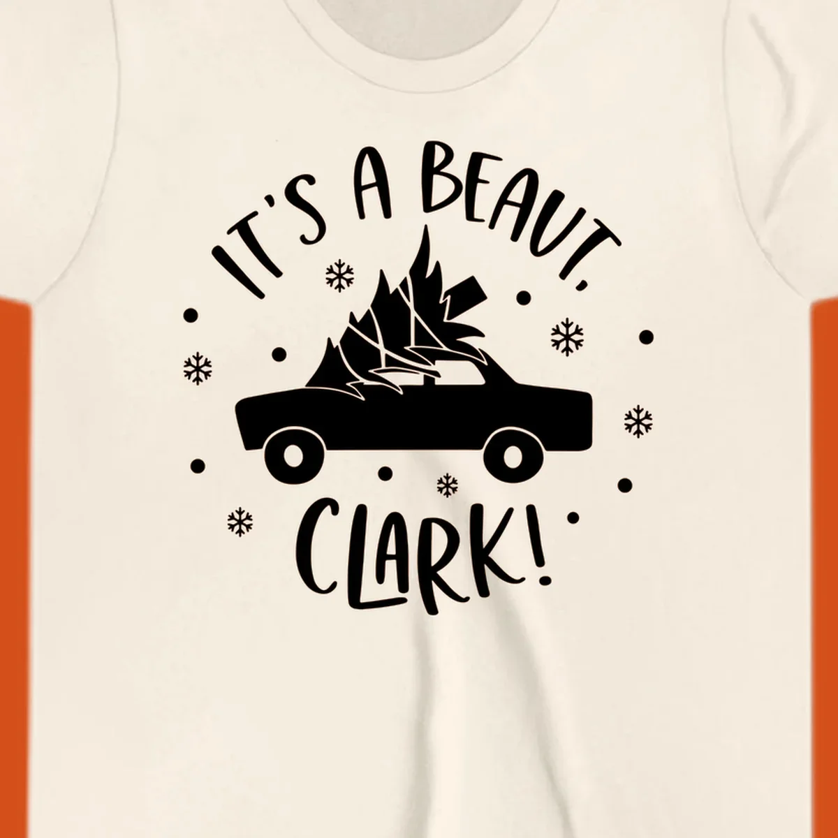 White silhouette of a car with a Christmas tree on top, and text 'IT'S A BEAUT, CLARK!'
