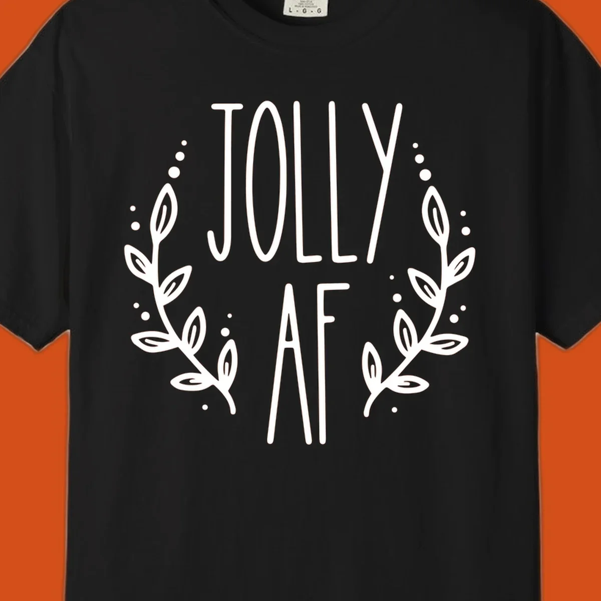 Jolly AF Christmas wreath design with text and leaves.
