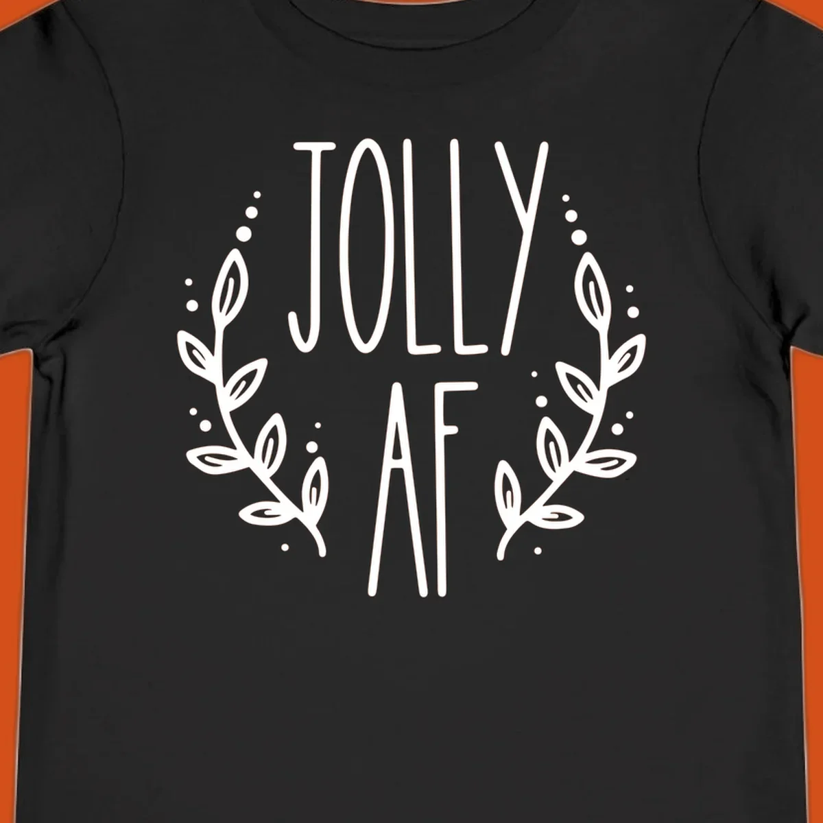 Jolly AF Christmas wreath design with text and leaves.