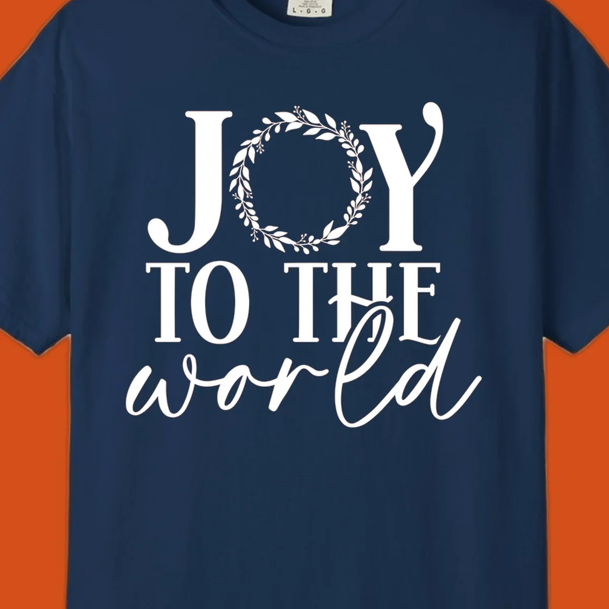 Joy to the World Christmas text design with a wreath replacing the letter O. White text on black background.