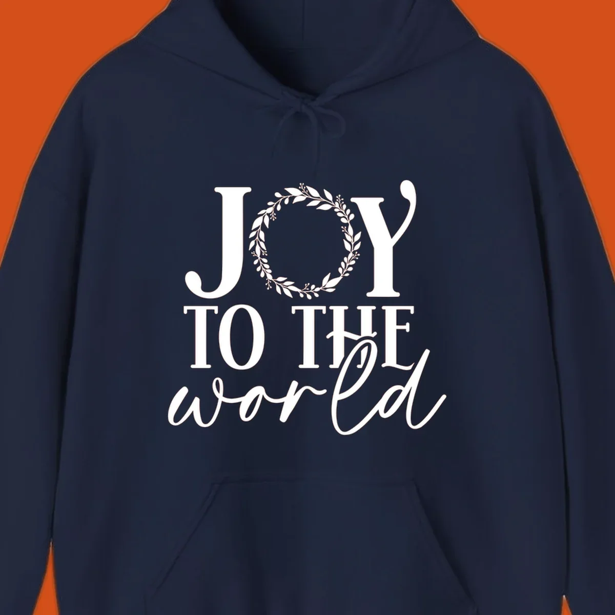 Joy to the World Christmas text design with a wreath replacing the letter O. White text on black background.