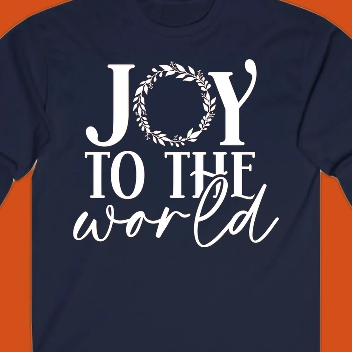 Joy to the World Christmas text design with a wreath replacing the letter O. White text on black background.