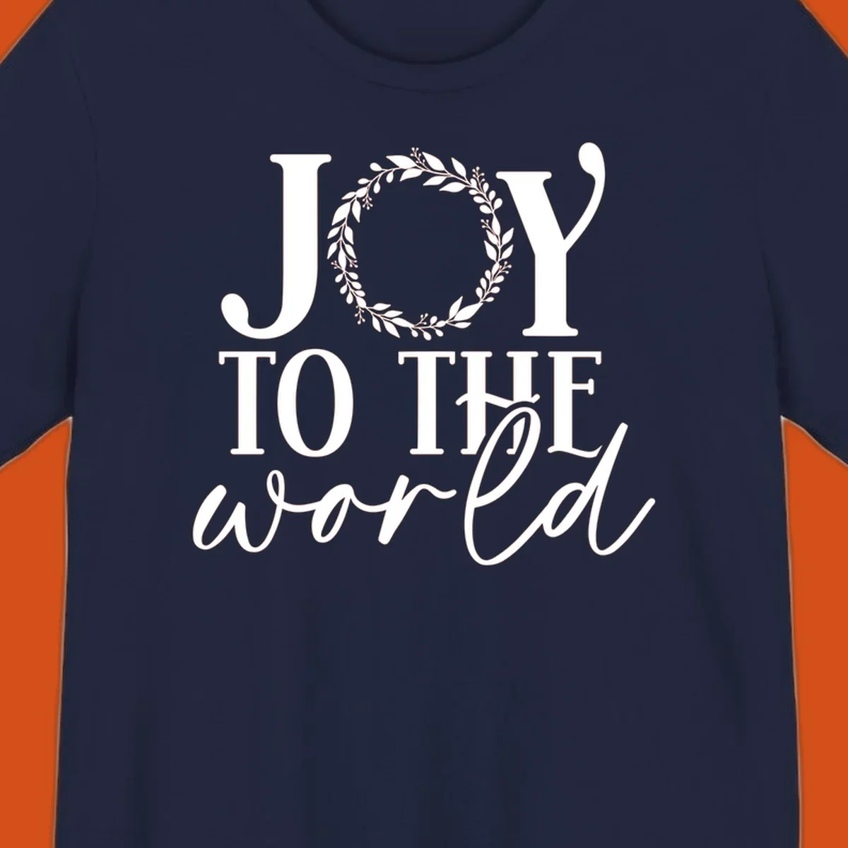 Joy to the World Christmas text design with a wreath replacing the letter O. White text on black background.