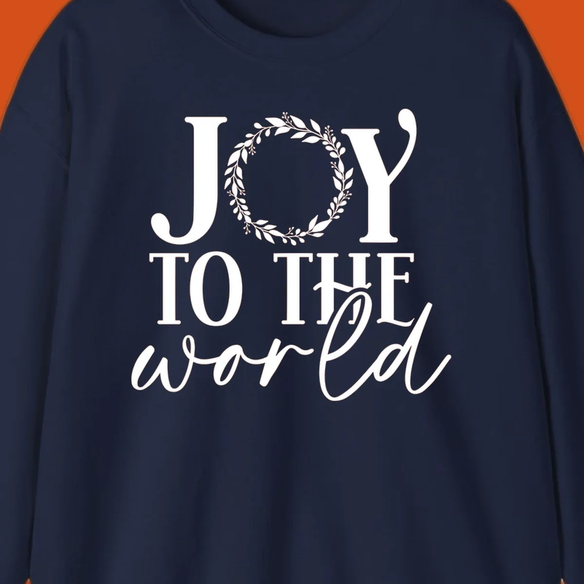 Joy to the World Christmas text design with a wreath replacing the letter O. White text on black background.