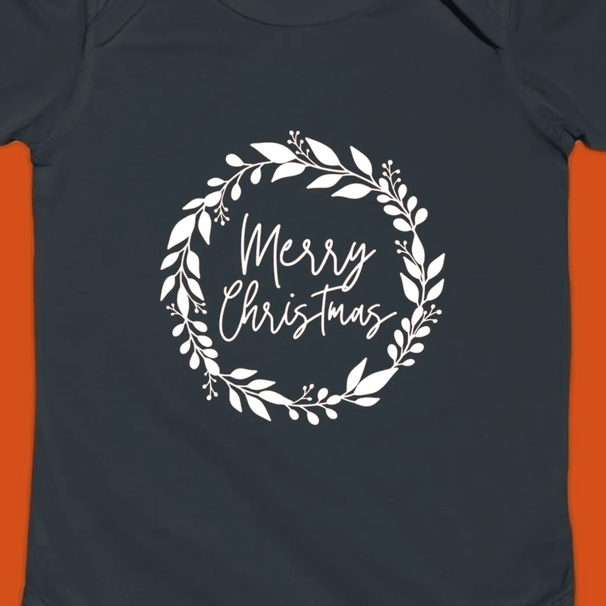 Merry Christmas text inside a white floral wreath graphic.