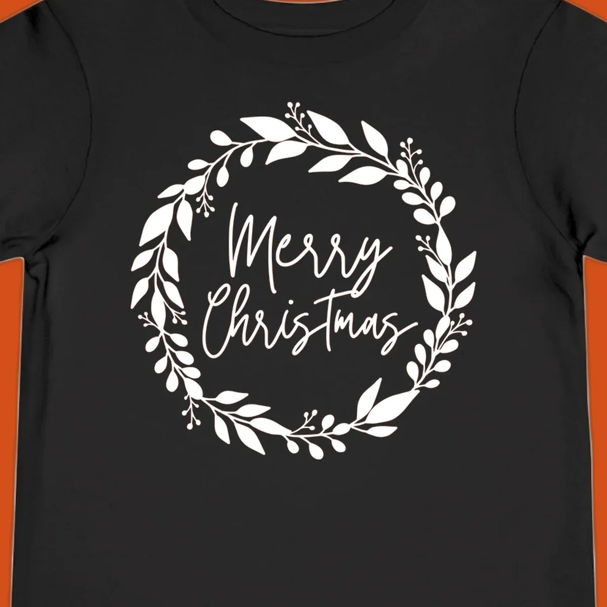 Merry Christmas text inside a white floral wreath graphic.