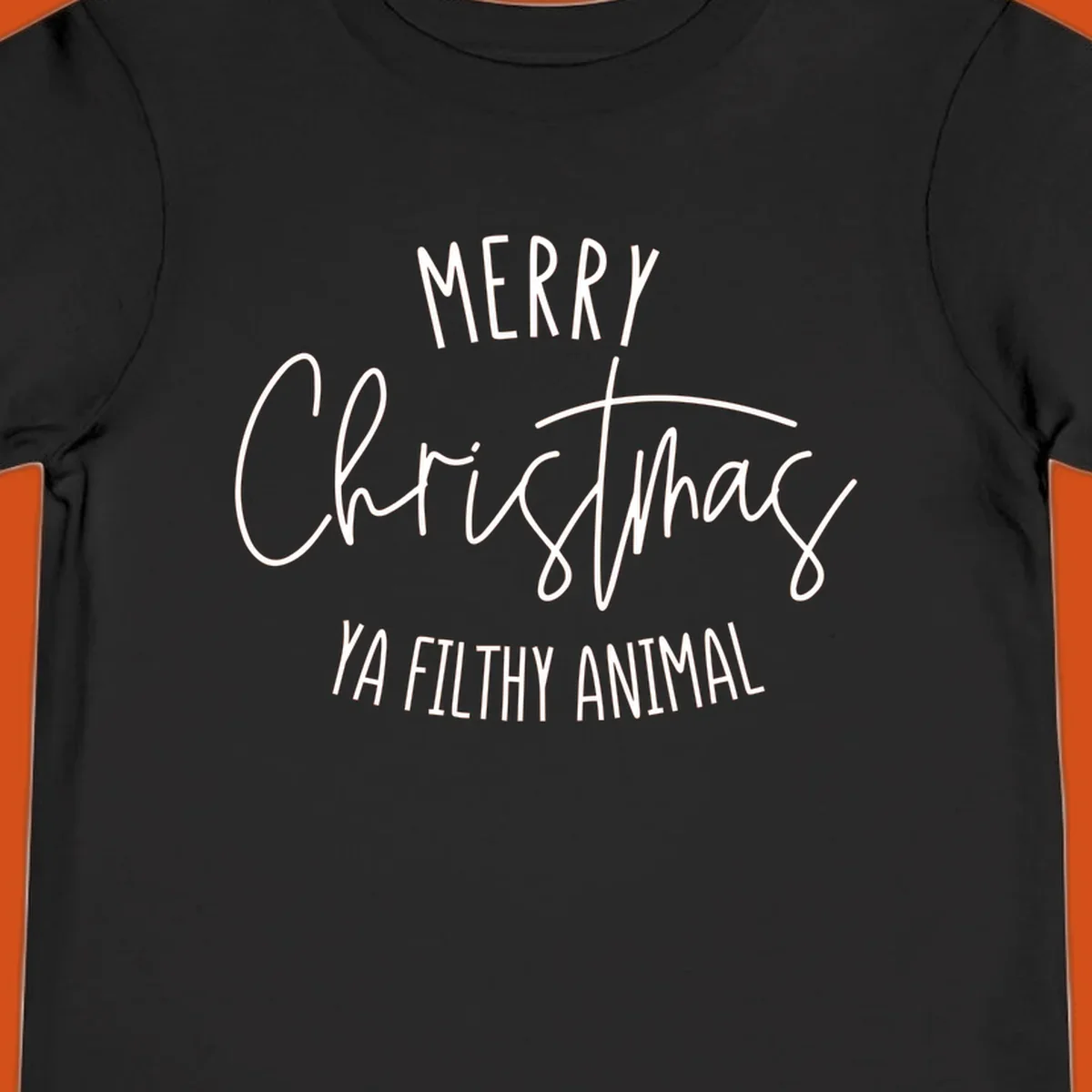 Merry Christmas Ya Filthy Animal text design in white, handwritten-style font.