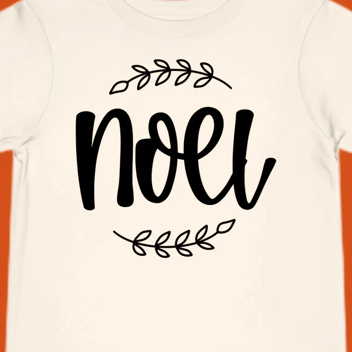 Elegant christmas noel script with leafy branches.