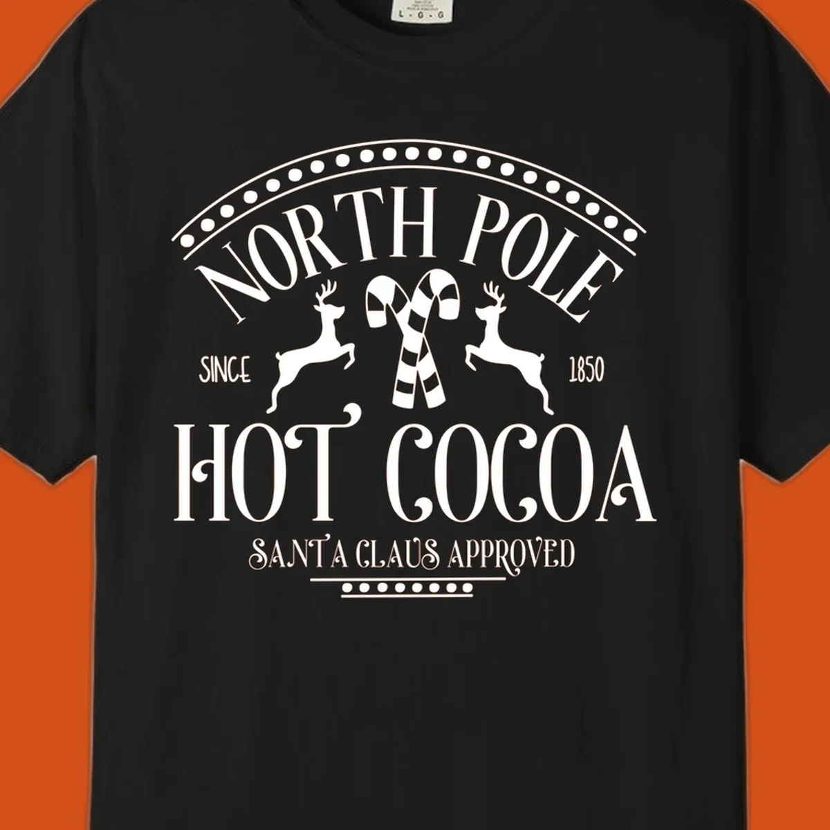 North Pole Hot Cocoa sign with reindeer and candy canes, Christmas holiday graphic.