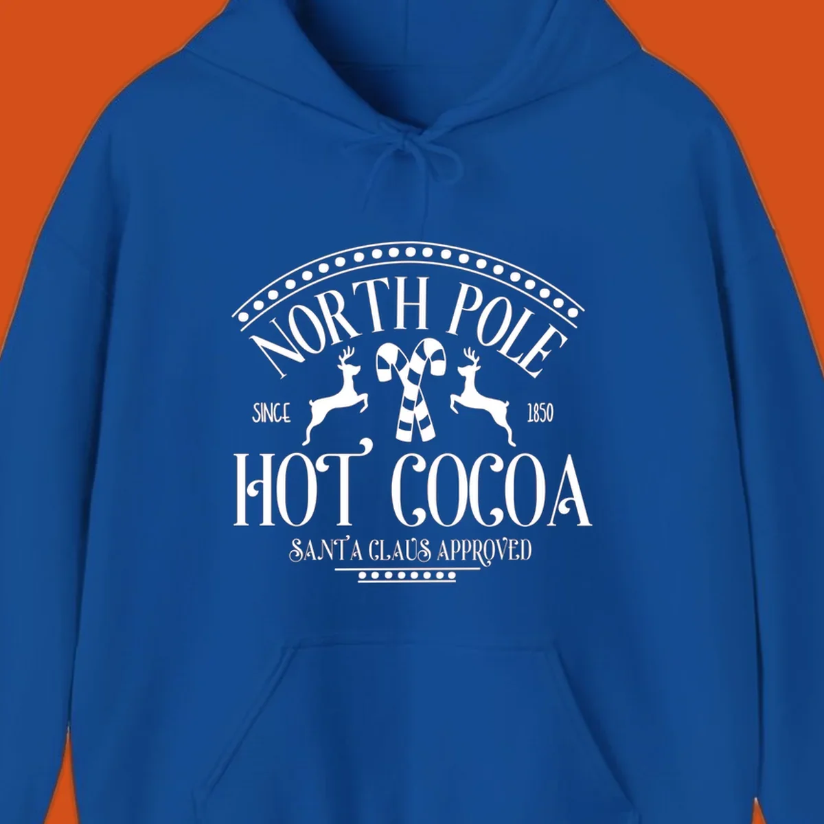North Pole Hot Cocoa sign with reindeer and candy canes, Christmas holiday graphic.