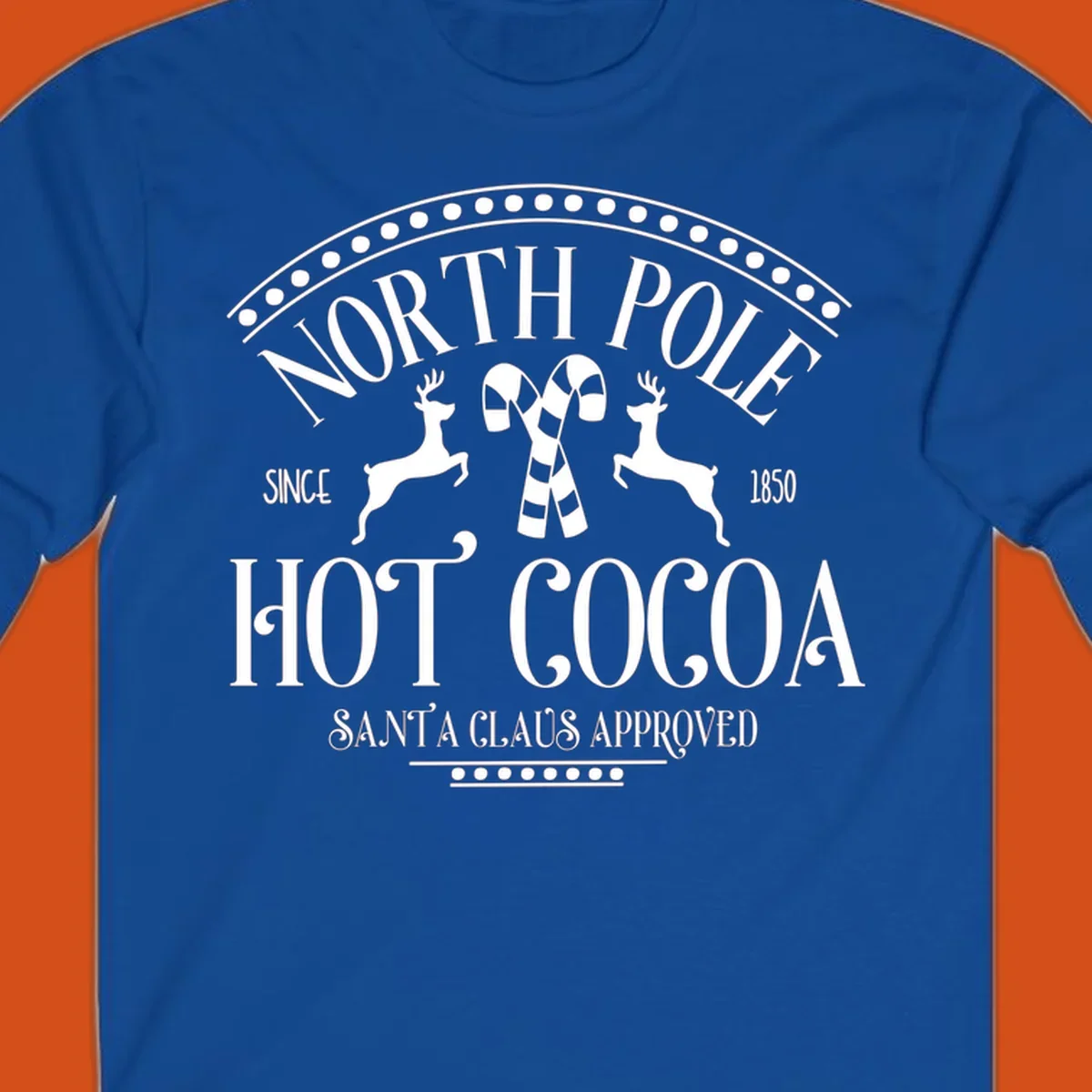 North Pole Hot Cocoa sign with reindeer and candy canes, Christmas holiday graphic.