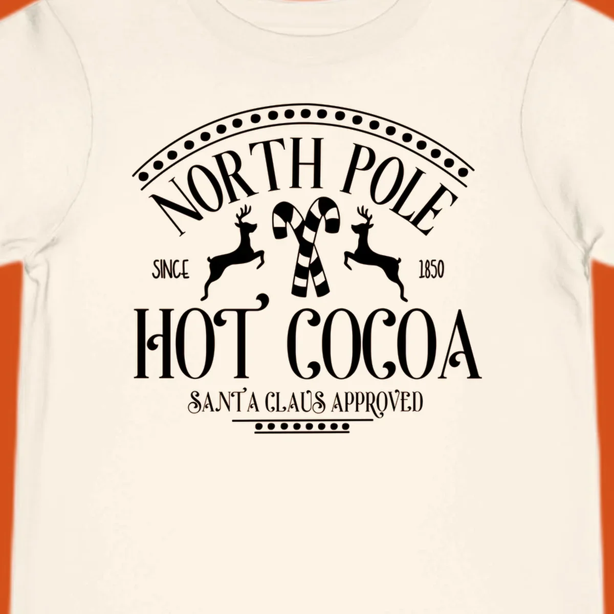 North Pole Hot Cocoa sign with reindeer and candy canes, Christmas holiday graphic.