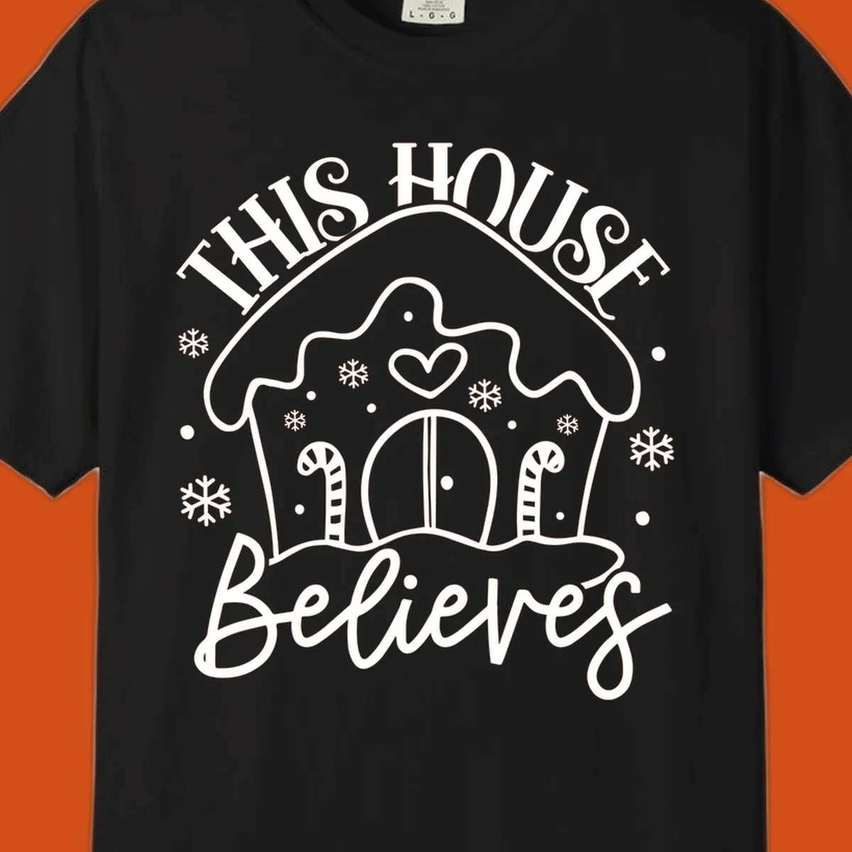 Gingerbread house graphic with 'This House Believes' text for Christmas.