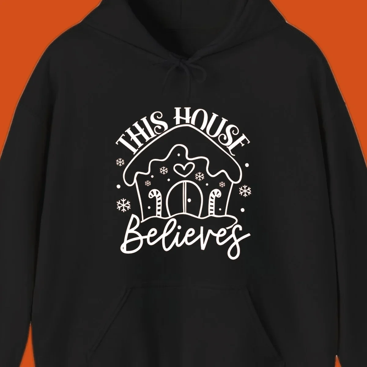 Gingerbread house graphic with 'This House Believes' text for Christmas.