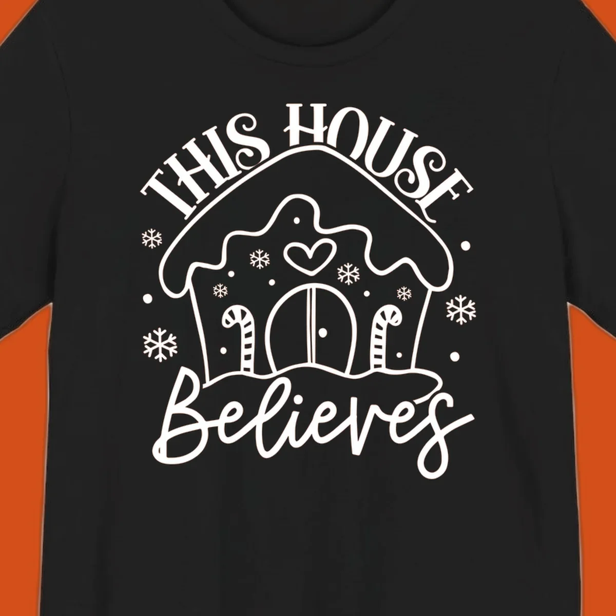 Gingerbread house graphic with 'This House Believes' text for Christmas.