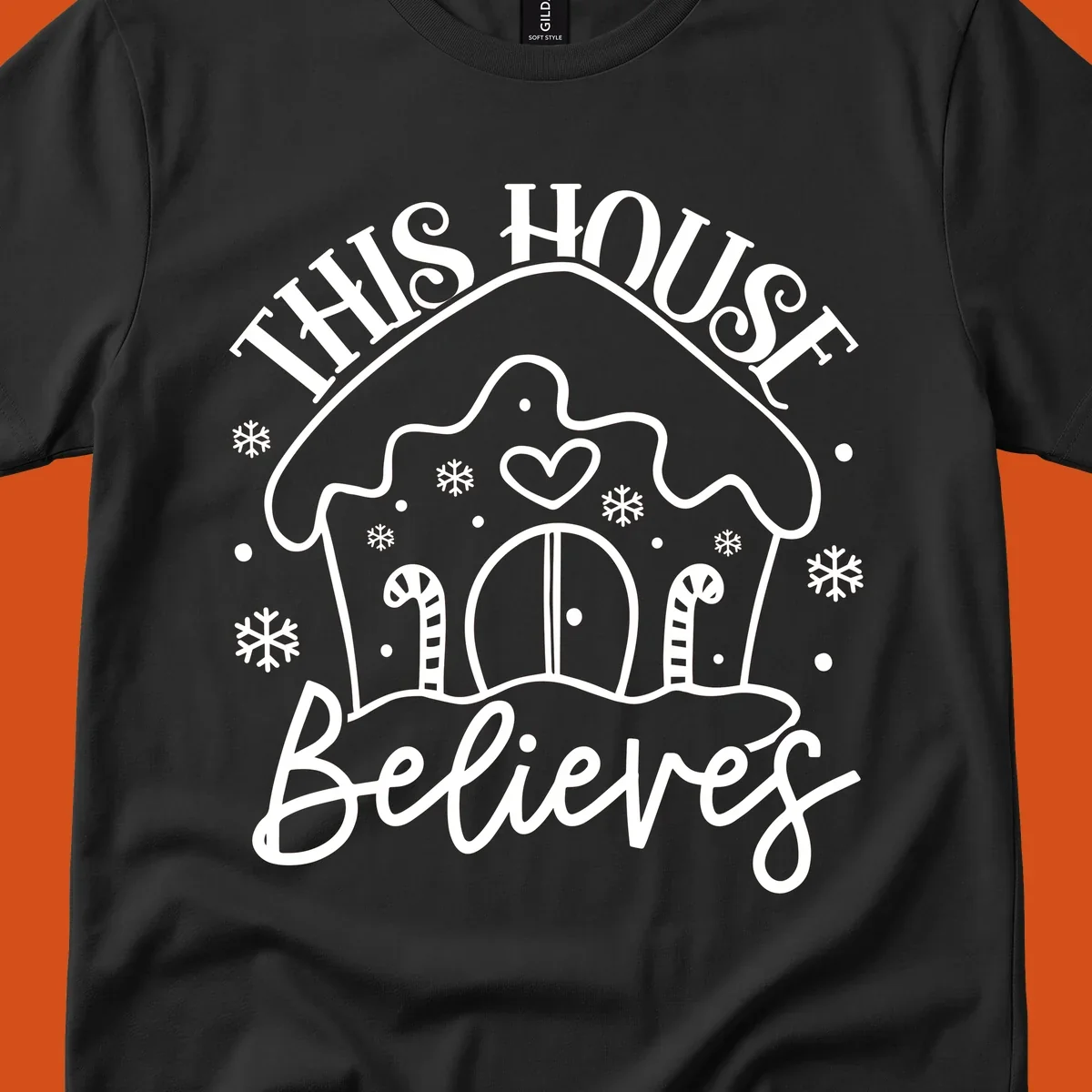 Gingerbread house graphic with 'This House Believes' text for Christmas.